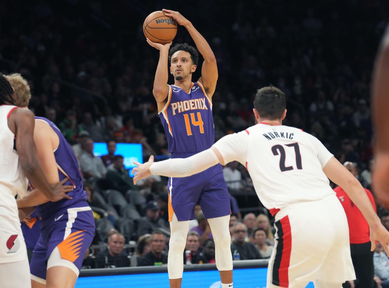 Nov 5, 2022; Phoenix, AZ, USA; Phoenix Suns guard Landry Shamet (14) shoots the ball against the Portland Trail Blazers at Footprint Center.