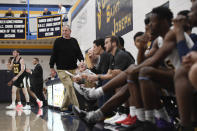 Saint Joseph coach Jim Calhoun walks back to the bench in the first half of the team's NCAA college basketball game against Pratt Institute, Friday, Jan. 10, 2020, in West Hartford, Conn. Now coaching Division III basketball with the same fire he stalked the sidelines at UConn, Jim Calhoun is reaching his 900th win as a college coach. (AP Photo/Jessica Hill)