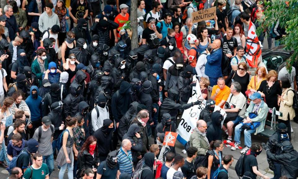 So-called ‘Black bloc’ anti-capitalists move among marchers converging on the Bastille in Paris on Saturday.