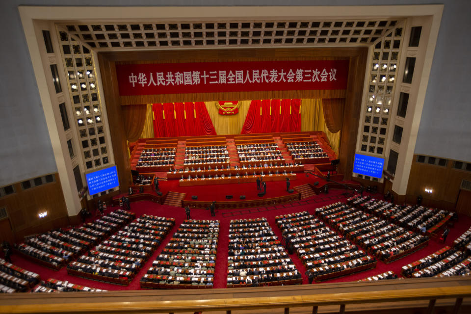 FILE - In this May 28, 2020, file photo, delegates and Chinese leaders attend the closing session of China's National People's Congress (NPC) in Beijing. The annual gathering of the National People's Congress and its advisory body, the Chinese People's Political Consultative Conference, brings handpicked delegates from across the country to discuss governing priorities and receive instructions from the ruling Communist Party leadership. (AP Photo/Mark Schiefelbein, File)