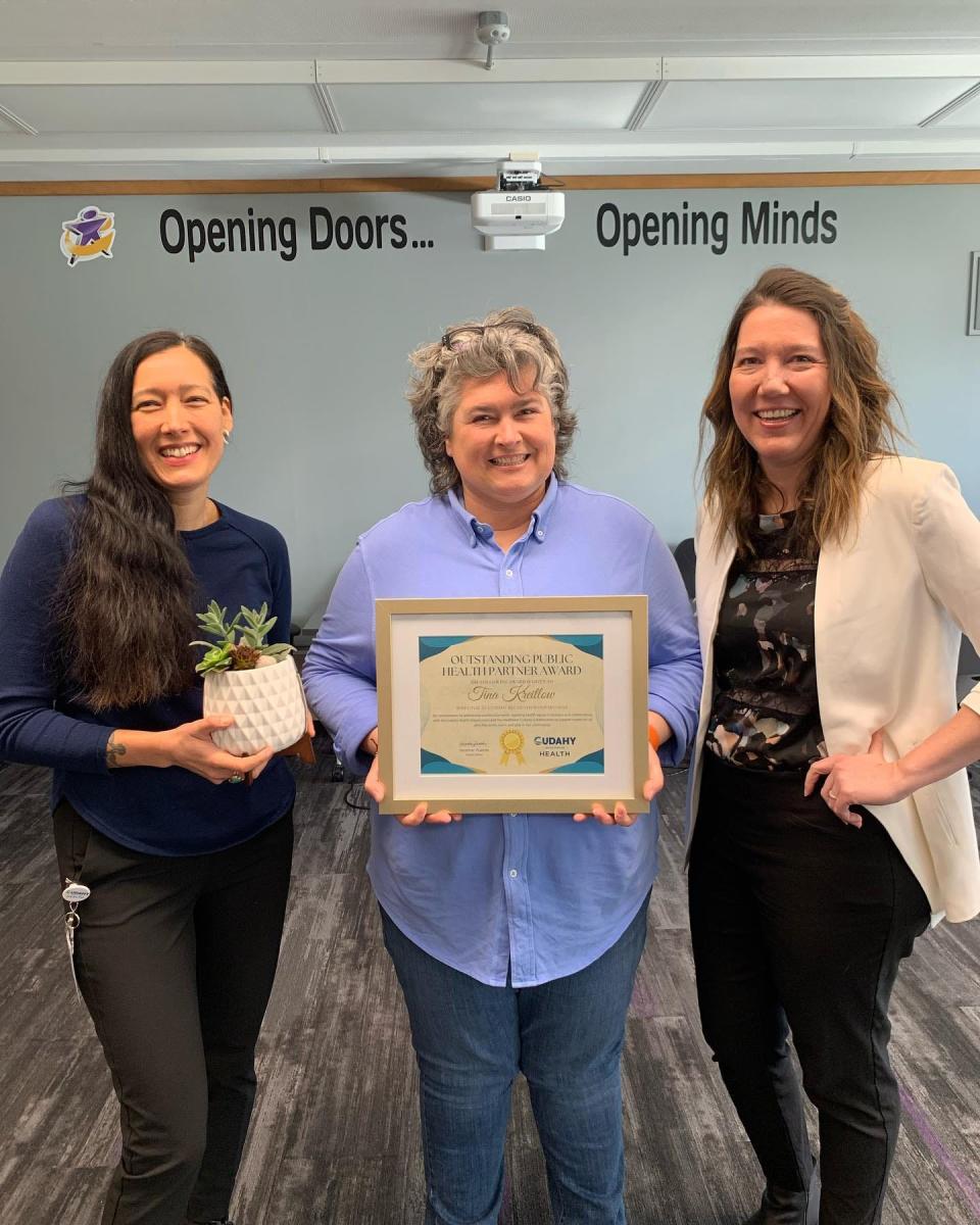 Tina Kreitlow (center), director of athletics and recreation, received an Outstanding Public Health Partner award from the Cudahy Health Department.