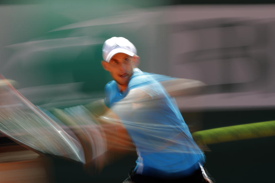 Austria's Dominic Thiem plays a shot against Russia's Karen Kachanov during their quarterfinal match of the French Open tennis tournament at the Roland Garros stadium in Paris, Thursday, June 6, 2019. (AP Photo/Pavel Golovkin)