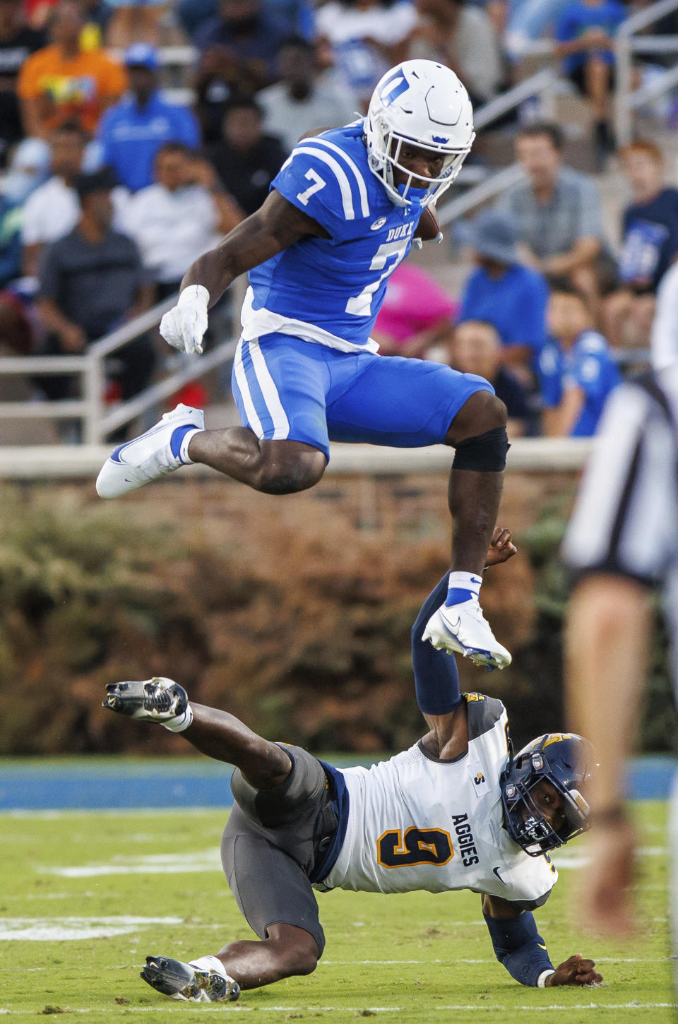 Duke's Jordan Waters (7) hurdles over North Carolina A&T's Janaz Sumpter (7) during the first half of an NCAA college football game in Durham, N.C., Saturday, Sept. 17, 2022. (AP Photo/Ben McKeown)