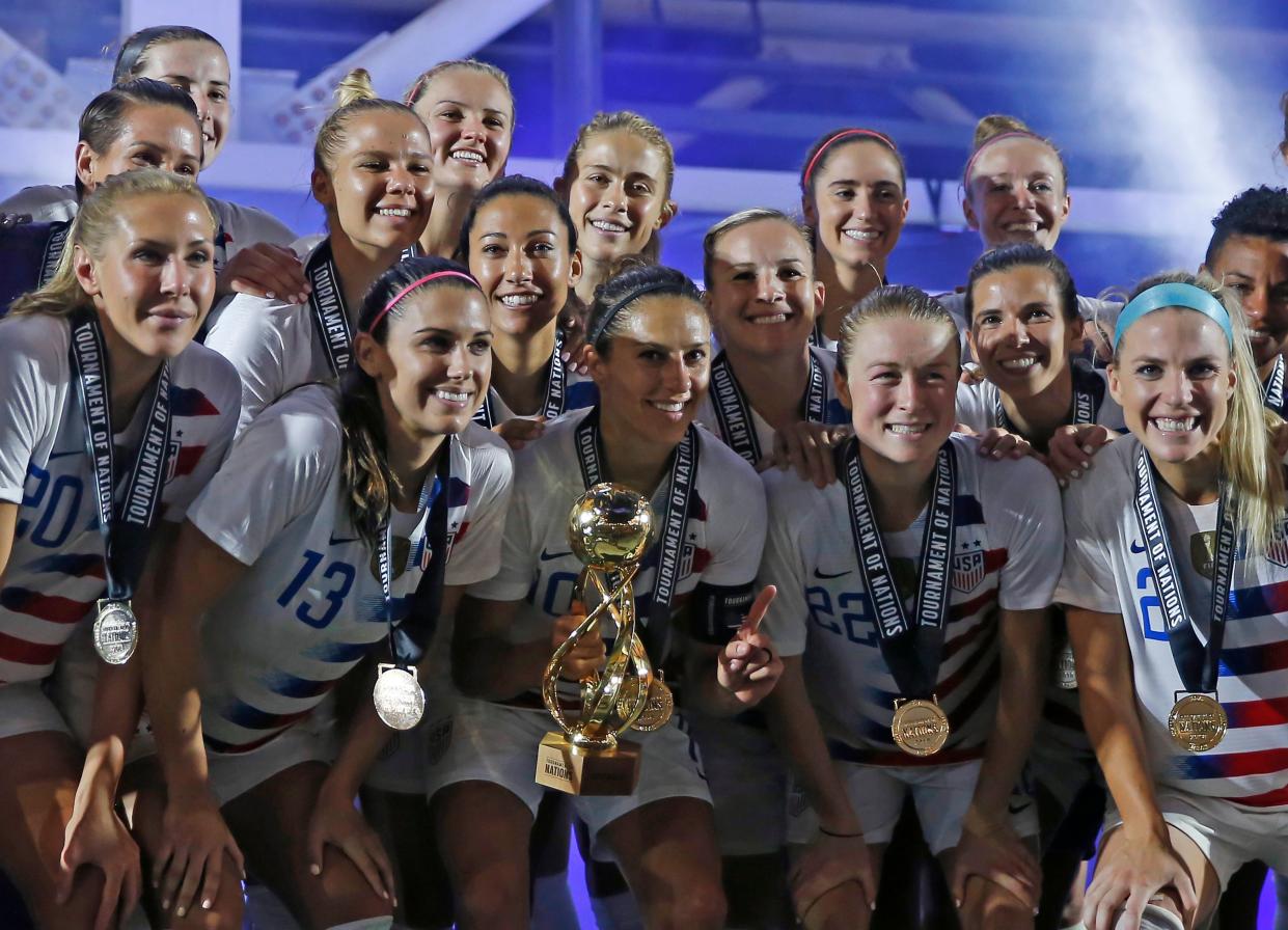 The U.S. women’s national team poses with the 2018 Tournament of Nations trophy. (Getty)