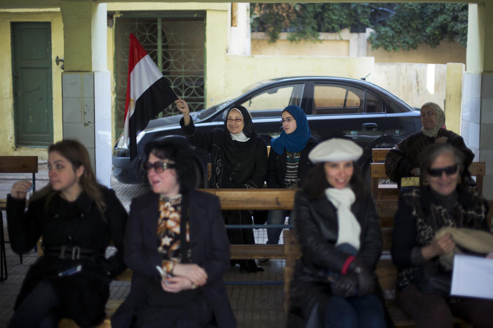 Egyptian women wait in a polling station to cast their votes in the country's constitutional referendum in Cairo, Egypt, Tuesday, Jan. 14, 2014. Egyptians have started voting on a draft for their country's new constitution that represents a key milestone in a military-backed roadmap put in place after President Mohammed Morsi was overthrown in a popularly backed coup last July.(AP Photo/Khalil Hamra)