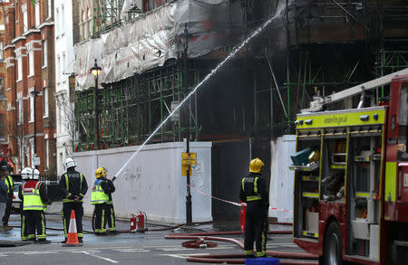 Firefighters work to control a fire at a construction site in central London, Britain, February 17, 2018. REUTERS/Simon Dawson