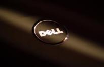A company logo of Dell is seen on the cover of its laptop at a Dell outlet in Hong Kong October October 21, 2009. REUTERS/Bobby Yip