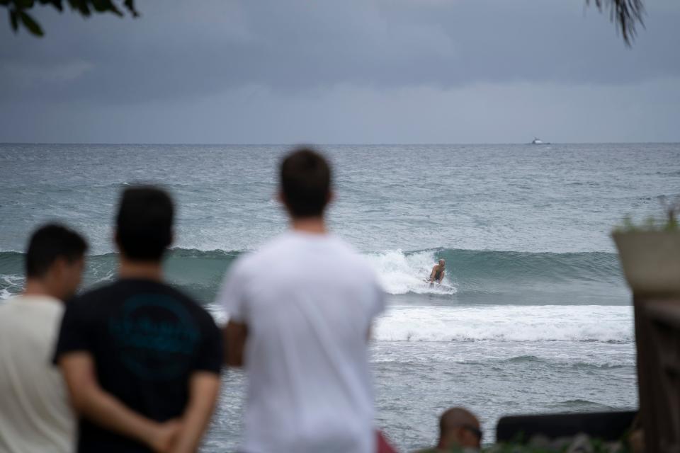 People gather at the coast hours before the storm enters in Patillas, Puerto Rico on, August 28, 2019. Tropical Storm Dorian bore down on Puerto Rico Wednesday as residents braced for a direct hit, the first since the island was ravaged two years ago by Hurricane Maria.