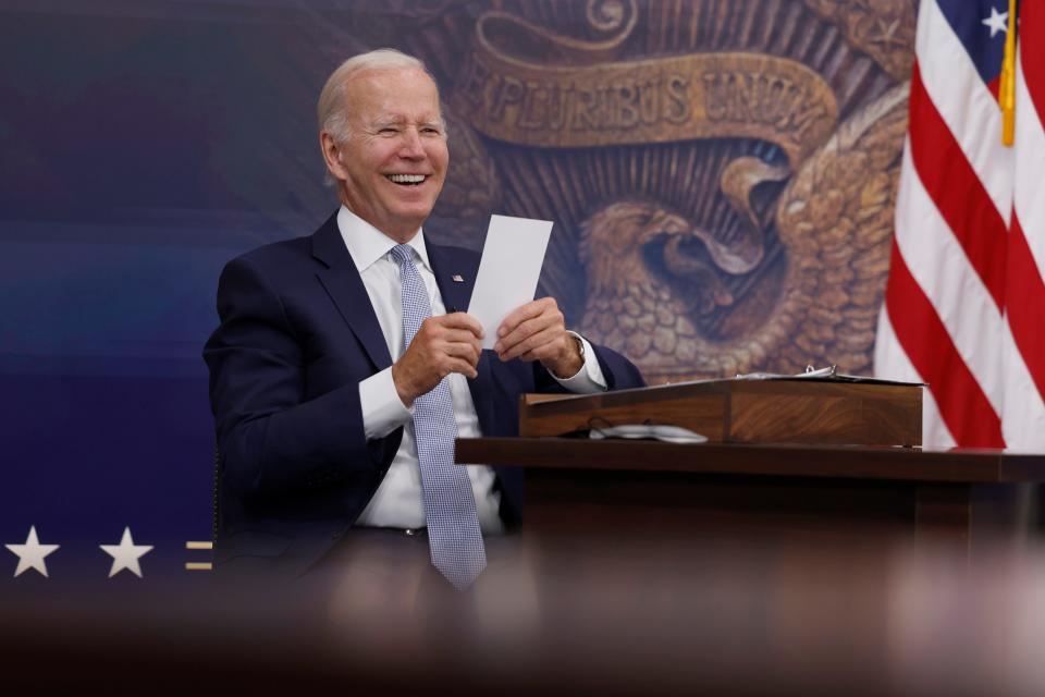 President Joe Biden reads a note from an aide saying that the Creating Helpful Incentives to Produce Semiconductors (CHIPS) for America Act had received enough yes votes in the House of Representatives to pass during a meeting in the South Court Auditorium of the White House on July 28, 2022, in Washington, DC. President Biden held the meeting on the U.S. Economy with CEOs and members of his Cabinet.