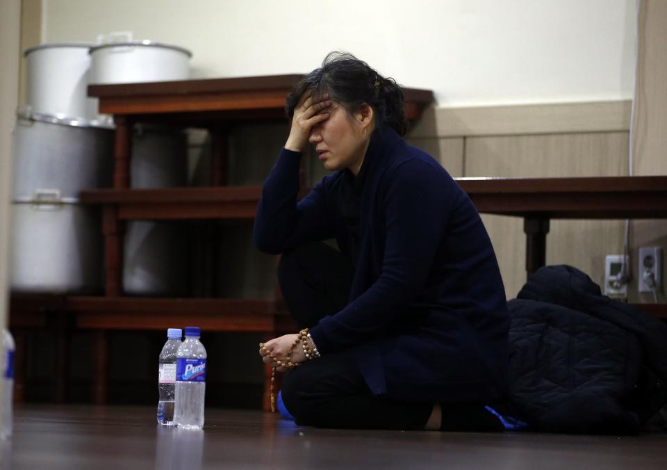 A mother of a victim who was killed when a resort building collapsed, mourns at a group memorial altar in Gyeongju