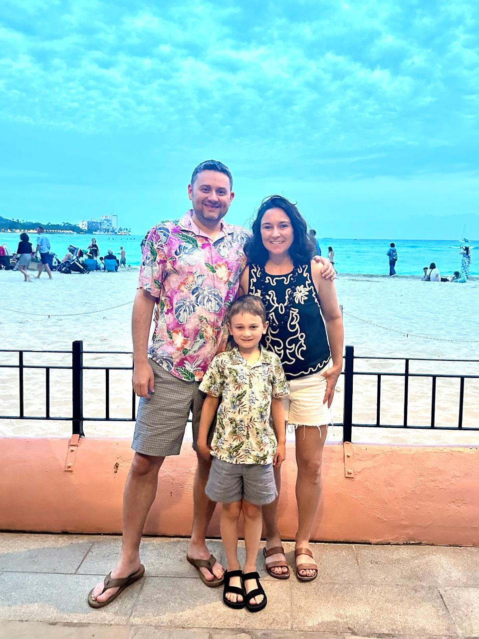 Nicole Findlay with her husband and son at Waikiki Beach.