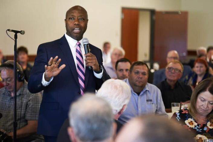 Sen. Tim Scott, R-S.C., speaks during an Iowa GOP reception, Thursday, June 9, 2022, in Cedar Rapids, Iowa. At least a half dozen GOP presidential prospects are planning Iowa visits this summer, forays that are advertised as promoting candidates and the state Republican organization ahead of the fall midterm elections. But in reality, the trips are about building relationships and learning the political geography in the state scheduled to launch the campaign for the party's 2024 nomination. (AP Photo/Charlie Neibergall)