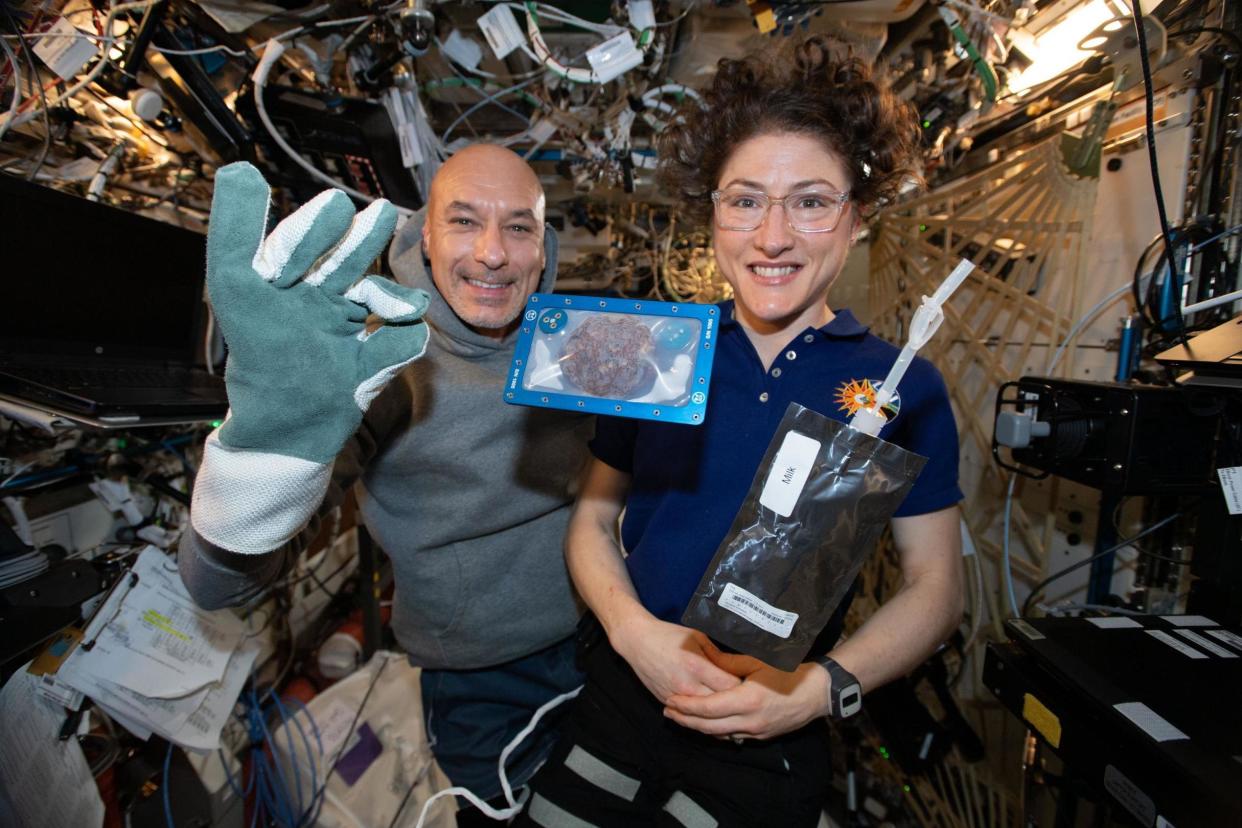 Commander Luca Parmitano and astronaut Christina Koch with milk and cookies in space: PA Media