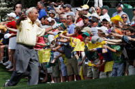 Golf great Arnold Palmer reacts to the fans during the Par 3 contest before the 2010 Masters golf tournament at the Augusta National Golf Club in Augusta, Georgia. REUTERS/Gary Hershorn