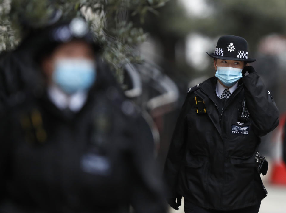 Police stand guard outside the King Edward VII hospital In London, Monday, Feb. 22, 2021, where Britain's Prince Philip is being treated. Prince Philip, 99, was admitted to the hospital on Tuesday on the advice of his doctor in what Buckingham Palace described as “a precautionary measure.” (AP Photo/Alastair Grant)