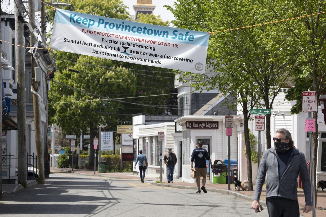 A sign suspended above a street