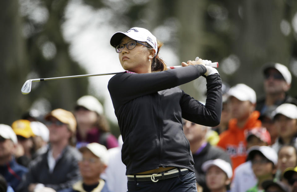 Lydia Ko, of New Zealand, follows her shot from the third tee of the Lake Merced Golf Club during the final round of the Swinging Skirts LPGA Classic golf tournament on Sunday, April 27, 2014, in Daly City, Calif. (AP Photo/Eric Risberg)