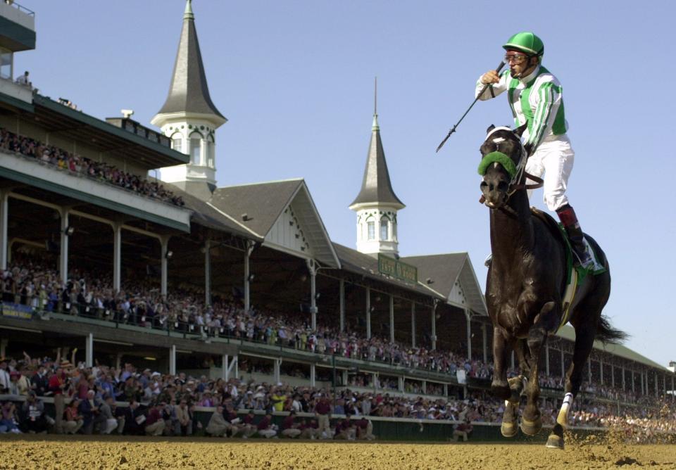Jockey Victor Espinoza rides War Emblem to victory in the 128th Kentucky Derby at Churchill Downs on Saturday, May 4, 2002, in Louisville, Ky.