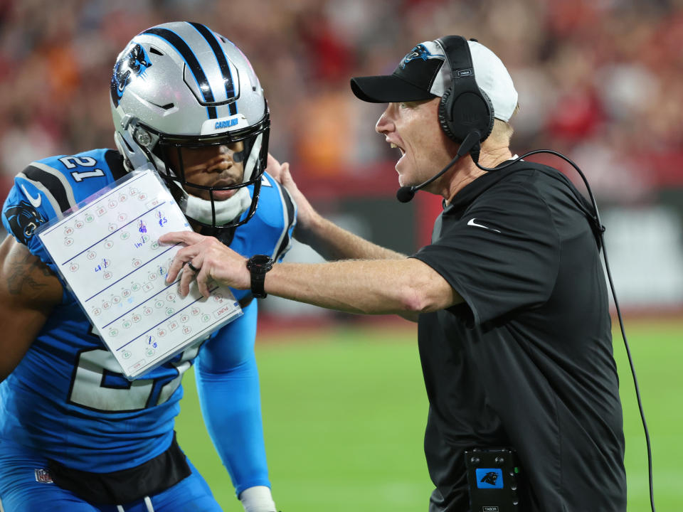 Dec 3, 2023; Tampa, Florida, USA; Carolina Panthers interim head coach Chris Tabor talks with safety <a class="link " href="https://sports.yahoo.com/nfl/players/32734" data-i13n="sec:content-canvas;subsec:anchor_text;elm:context_link" data-ylk="slk:Jeremy Chinn;sec:content-canvas;subsec:anchor_text;elm:context_link;itc:0">Jeremy Chinn</a> (21) against the <a class="link " href="https://sports.yahoo.com/nfl/teams/tampa-bay/" data-i13n="sec:content-canvas;subsec:anchor_text;elm:context_link" data-ylk="slk:Tampa Bay Buccaneers;sec:content-canvas;subsec:anchor_text;elm:context_link;itc:0">Tampa Bay Buccaneers</a> during the second half at Raymond James Stadium. Mandatory Credit: Kim Klement Neitzel-USA TODAY Sports