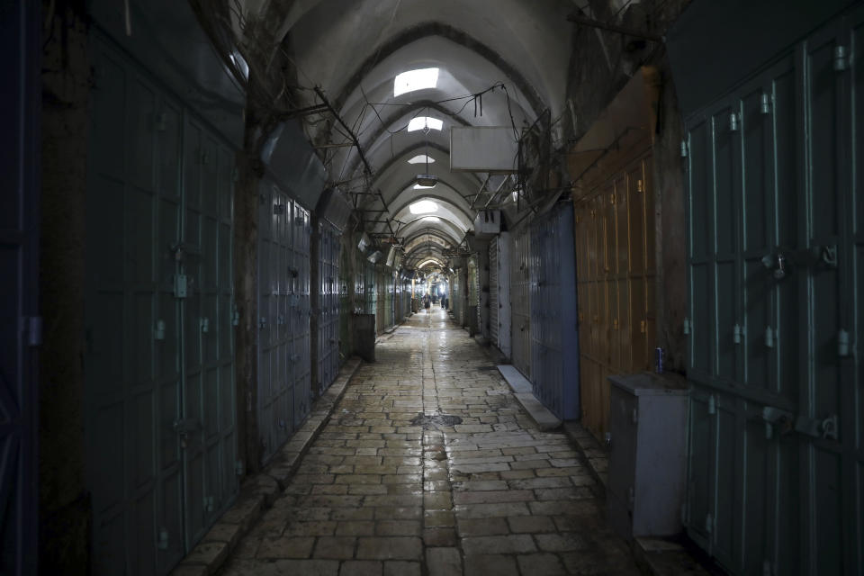 Closed shops and an empty alley is seen in Jerusalem's Old City, Monday, March 23, 2020. In Israel daily life has largely shut down with coronavirus cases multiplying greatly over the past week, (AP Photo/Mahmoud Illean)