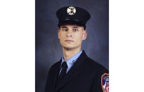 FILE - This undated, file photo provided on April 9, 2019, by the Fire Department of New York shows firefighter Christopher Slutman. The 15-year member of the Fire Department was among three American service members killed by a roadside bomb in Afghanistan on Monday, April 8. (Fire Department of New York via AP, File)