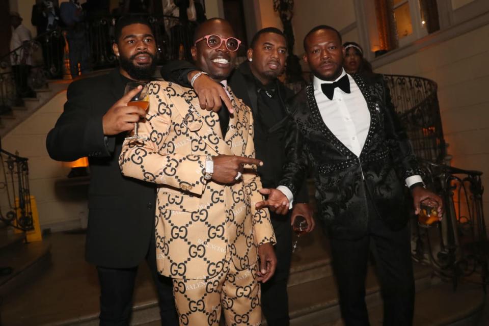 <div class="inline-image__caption"><p>Bishop Lamor Whitehead (in tan Gucci suit) photographed a a party in New York earlier this year. </p></div> <div class="inline-image__credit">Photo by Johnny Nunez/WireImage via Getty</div>