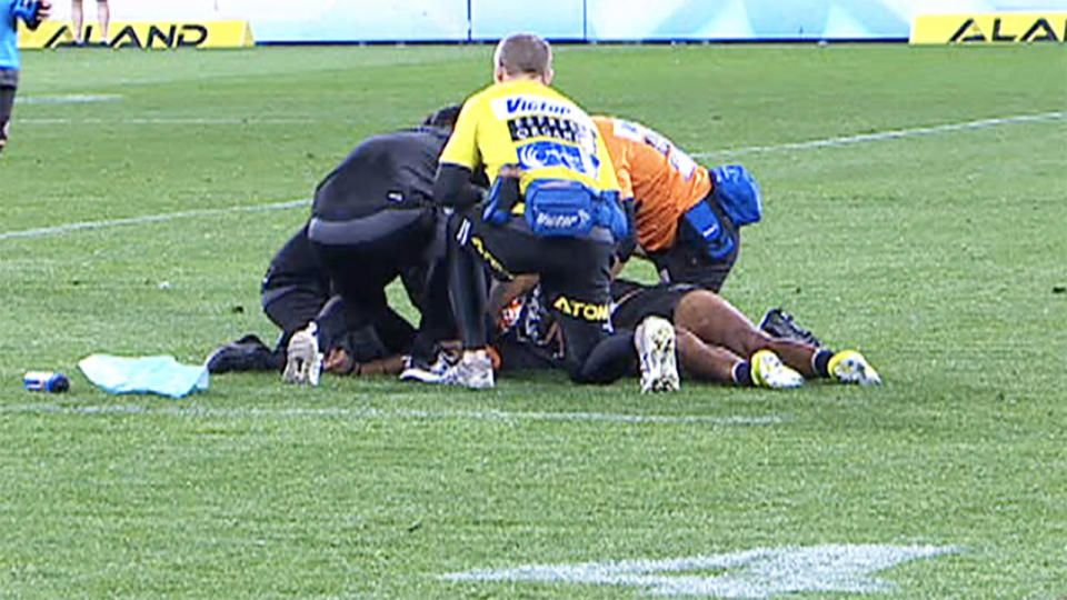 Michael Chee Kam, pictured here convulsing on the field after being knocked out.