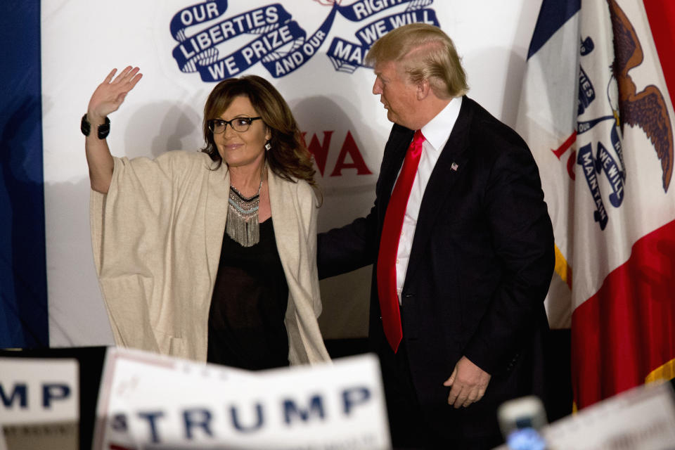 FILE - Then-Republican presidential candidate Donald Trump is joined on stage by former Republican vice presidential candidate, and former Alaska Gov. Sarah Palin during a campaign event on Feb. 1, 2016, in Cedar Rapids, Iowa. Former Alaska Gov. Sarah Palin has picked up a prized endorsement in her bid in an extremely crowded field to fill the unexpired term of the late U.S. Rep. Don Young. Former President Donald Trump backed Palin on Sunday, April 3, 2022, in a statement from his political action committee.(AP Photo/Mary Altaffer, File)