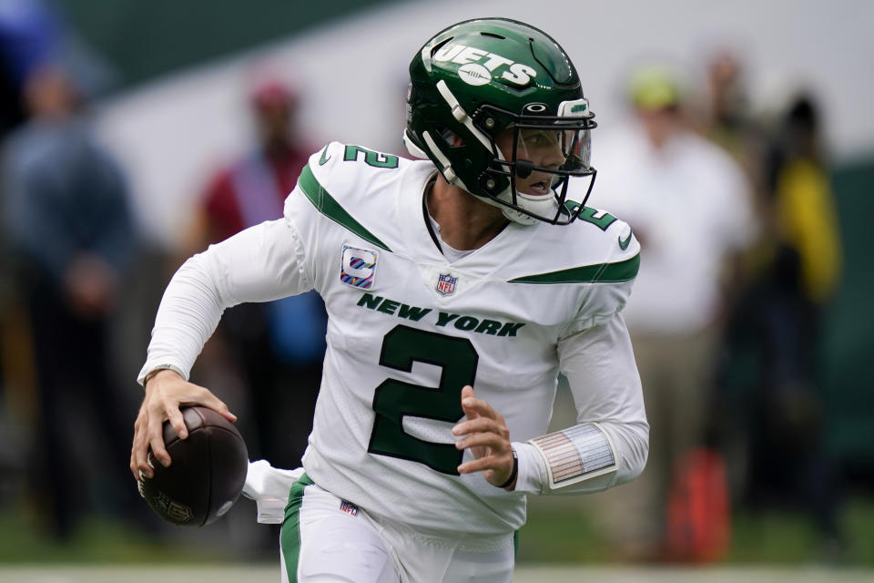 New York Jets quarterback Zach Wilson looks to pass on th run during the first half of an NFL football game against the Tennessee Titans, Sunday, Oct. 3, 2021, in East Rutherford. (AP Photo/Seth Wenig)