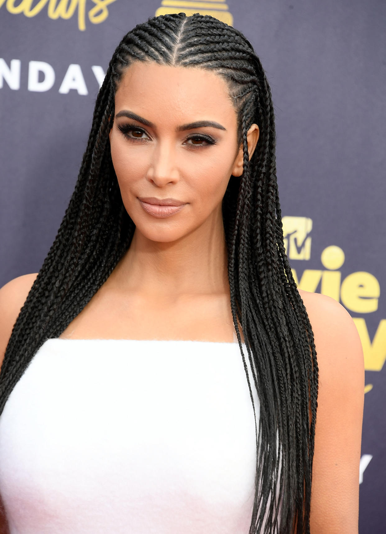Kim Kardashian West, seen here at the 2018 MTV Movie And TV Awards, has been accused by some of altering her appearance to resemble a Black woman. (Getty Images)