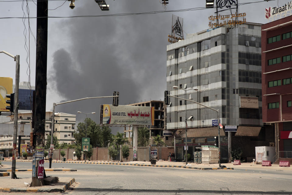 Smoke is seen rising from a neighborhood in Khartoum, Sudan, Saturday, April 15, 2023. Fierce clashes between Sudan's military and the country's powerful paramilitary erupted in the capital and elsewhere in the African nation after weeks of escalating tensions between the two forces. The fighting raised fears of a wider conflict in the chaos-stricken nation. (AP Photo/Marwan Ali)