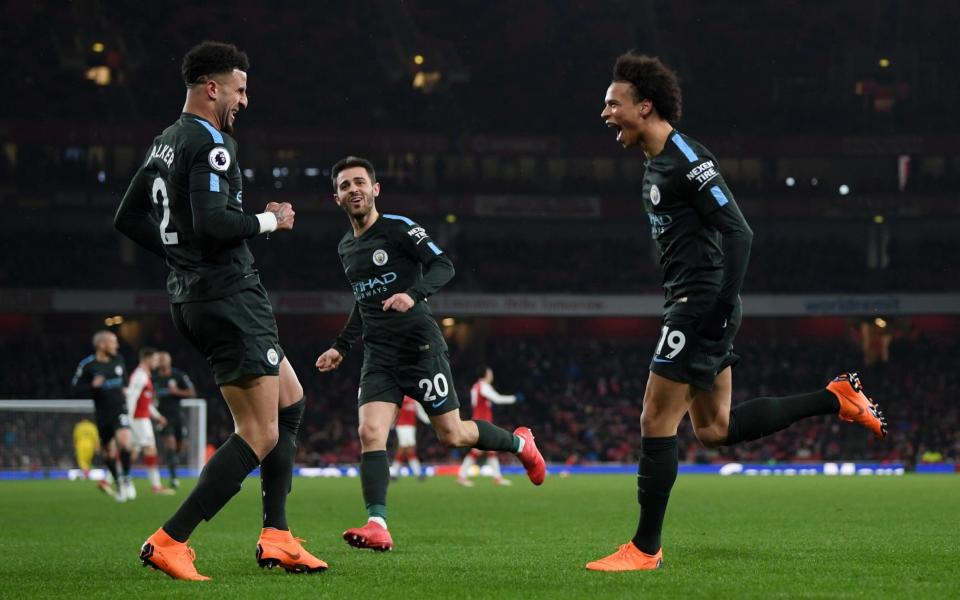 Leroy Sane celebrates scoring Man City's third in a rampant first half display - Getty Images Europe