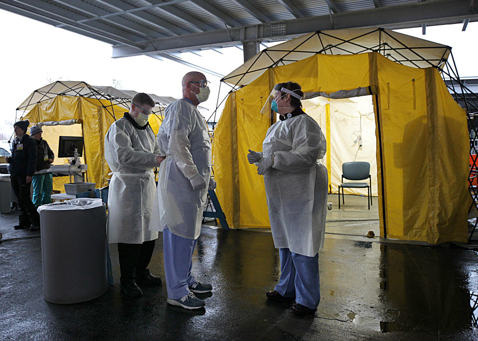 NEWTON, MA - MARCH 17: Medical professionals work in coronavirus testing tents at Newton Wellesley Hospital in Newton, MA on March 17, 2020. (Photo by Suzanne Kreiter/The Boston Globe via Getty Images)