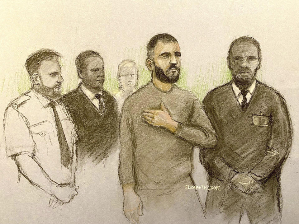 This court artist sketch by Elizabeth Cook shows Marcus Arduini Monzo appearing at Westminster Magistrates' Court in London, Thursday May 2, 2024. Monzo, accused of brandishing a sword in a rampage in London that killed a teenage boy, severely injured two police officers and wounded two men appeared in court Thursday to face charges of murder and attempted murder. (Elizabeth Cook/PA via AP)