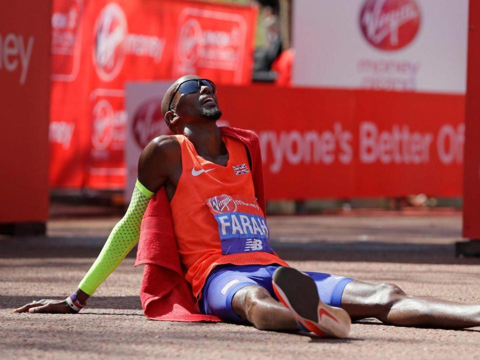 Farah collapsed with exhaustion afterwards (AP)