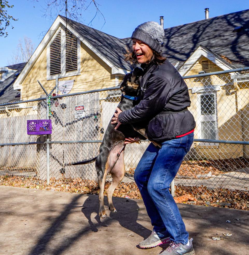 Volunteer Barb Bush takes Baxter for a walk and time outside at IndyHumane on Wednesday, Nov. 29, 2023. Baxter will soon be up for adoption.