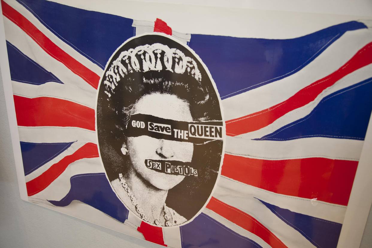 London, UK. Friday 23rd November 2012. Christies auction house showcasing memorabilia from every decade of the past century of popular culture from the industries of film and music. Original Sex Pistols print. God Save The Queen. (Photo by In Pictures Ltd./Corbis via Getty Images)