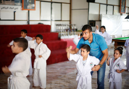 Palestinian children take part in a karate training session at a club in Gaza City July 17, 2016. REUTERS/Suhaib Salem