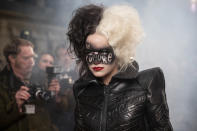 This image released by Disney shows Emma Stone in a scene from "Cruella." Costumes for the film were designed by Oscar winning designer Jenny Beavan. (Laurie Sparham/Disney via AP)