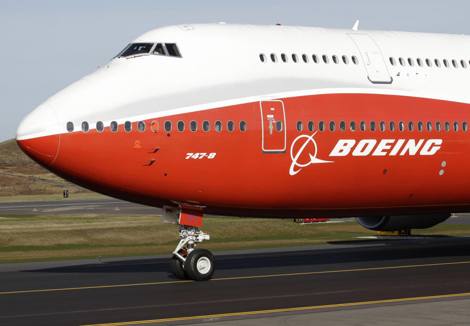 FILE - A Boeing 747-8, Boeing's new passenger plane, taxis for its first flight, Sunday, March 20, 2011, at Paine Field in Everett, Wash. After more than half a century, Boeing is rolling its last 747 out of a Washington state factory on Tuesday night. (AP Photo/Ted S. Warren, File)