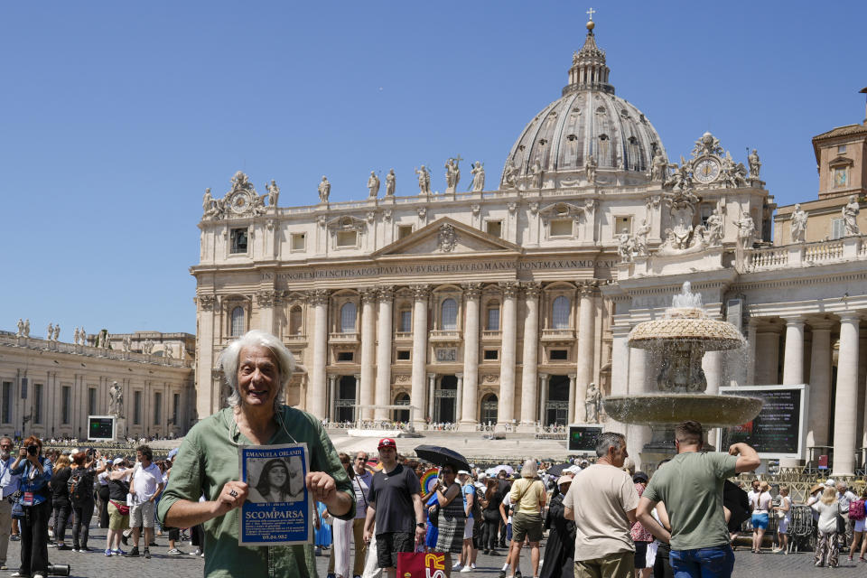 Pietro Orlandi holds a placard with a picture of his sister Emanuela as he arrives in St.Peter's Square prior to Pope Francis' Angelus noon prayer, at the Vatican, Sunday, June 25, 2023. The Pope in his speech remembered the 40th anniversary of the disappearance of Emanuela Orlandi, the 15-year-old daughter of a lay employee of the Holy See, that vanished June 22, 1983, after leaving her family's Vatican City apartment to go to a music lesson in Rome. (AP Photo/Andrew Medichini)