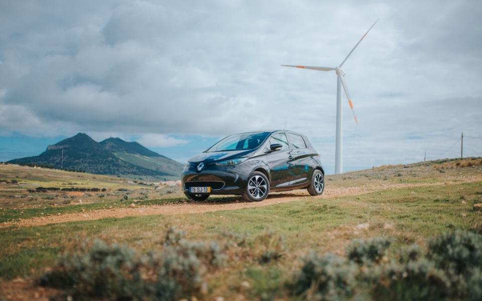 Renault Zoe on Porto Santo with the island's wind turbines in the background