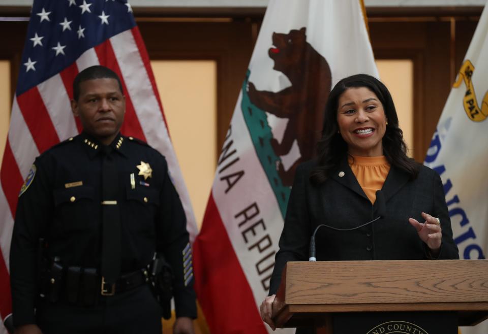San Francisco Mayor London Breed speaks during a press conference as San Francisco police chief William Scott looks on at San Francisco City Hall on March 16, 2020 in San Francisco, California.
