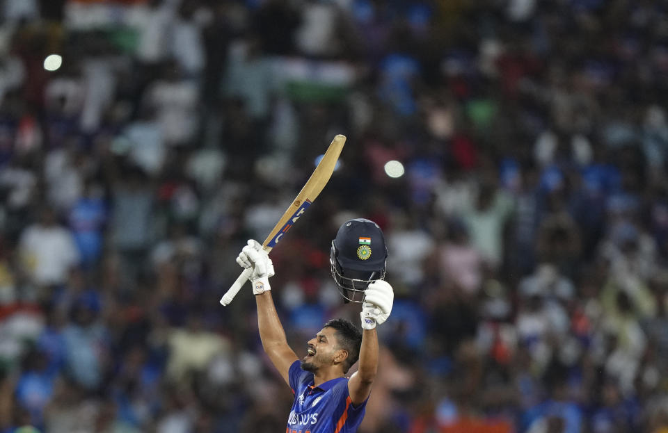 India's Shreyas Iyer raises his bat to celebrate his century during the second one day international cricket match between India and South Africa, in Ranchi , India, Sunday, Oct. 9, 2022. (AP Photo/Mahesh Kumar A.)