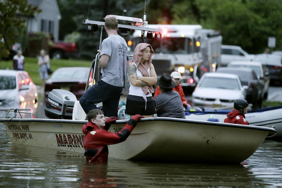 Rescuers guide boats on High St as they bring people to safety after overnight thunderstorms flooded much of Westville, N.J. on Wednesday, June 20, 2019. (Photo: Elizabeth Robertson/The Philadelphia Inquirer via AP)