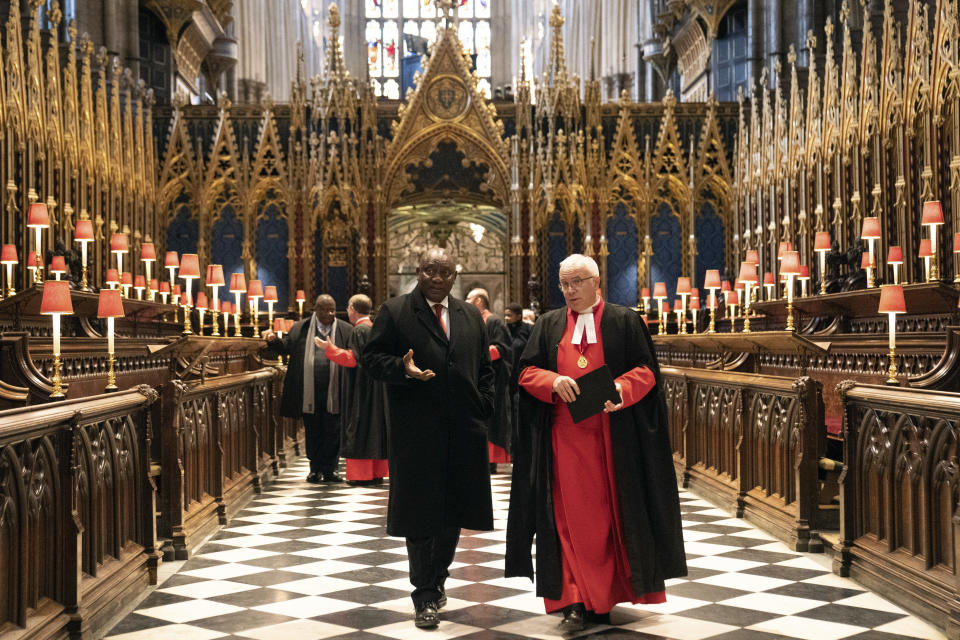 South African President Cyril Ramaphosa, right, visits Westminster Abbey accompanied by the Dean Of Westminster Abbey The Very Reverend David Hoyle, as part of his state visit, in London, Tuesday Nov. 22, 2022. (Stefan Rousseau/Pool photo via AP)