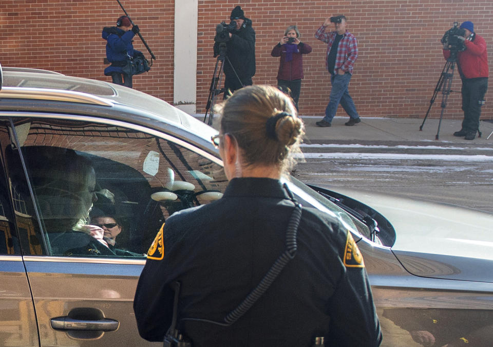 FILE - In this Feb. 8, 2019, file photo, Krystal Jean Lee Kenney, left, leaves in a car as various media record her exit from the Teller Combined Court in Cripple Creek, Colo. Kenney, 32, of Hansen, Idaho, pleaded guilty Friday, to tampering with evidence connected to the death of Kelsey Berreth, who was last seen on Nov. 22. Colorado Bureau of Investigation Agent Gregg Slater testified Tuesday, Feb. 19, 2019, that Kenney told investigators that she and Patrick Frazee became involved in March 2018. (Dougal Brownlie/The Gazette via AP, File)