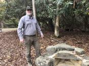 National Park Service maintenance mechanic John Coffelt is shown Wednesday, Oct. 27, 2021, standing over one of the fire pits he helped restore at a visitor center in Grandview, W.Va. Under legislation passed by Congress in 2020, some of America's most spectacular natural settings are getting a makeover. (AP Photo/John Raby)