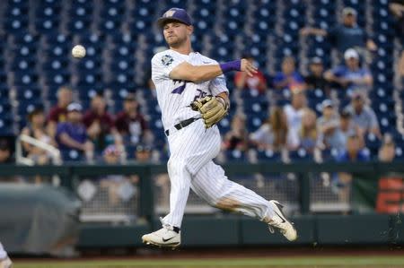 Jun 18, 2018; Omaha, NE, USA; Washington Huskies shortstop Levi Jordan (26) throws to first base in the eighth inning against the Oregon State Beavers in the College World Series at TD Ameritrade Park. Mandatory Credit: Steven Branscombe-USA TODAY Sports