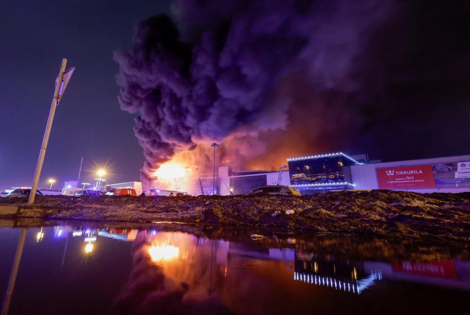 Smoke from fire rises above the burning Crocus City Hall concert venue following a shooting incident, outside Moscow, Russia, 22 March 2024. (REUTERS)